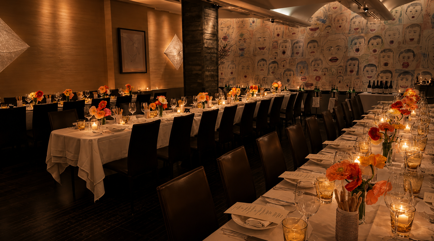 Rehearsal dinner at Caravaggio on the Upper East Side — long candlelit table with orange ranunculus centerpieces and printed menus